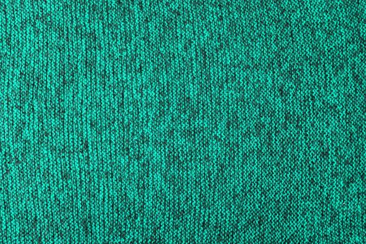 mixed aqua green and black knitted texture and flat background