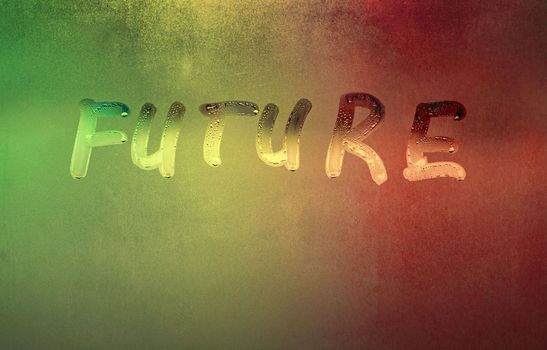 word future handwritten on night foggy window glass surface, close-up with selective focus