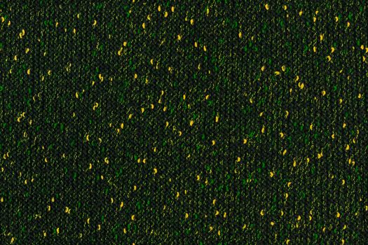 black melange manually knitted fabric with green and yellow blotches - seamless texture and flat background.
