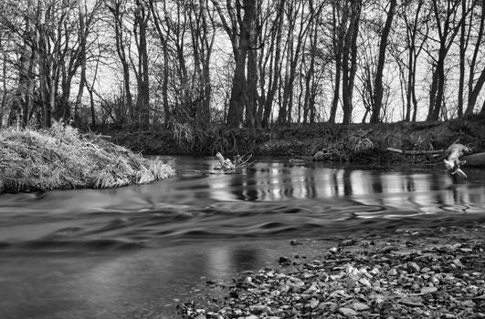 Frosty river with sunrise cold day