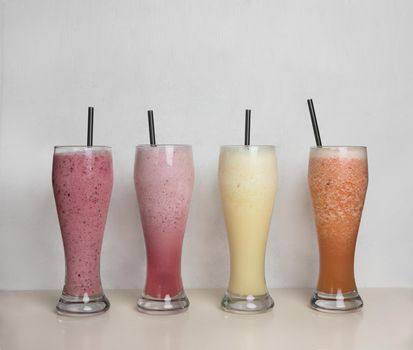 Fruit milky cocktails on a isolated white background