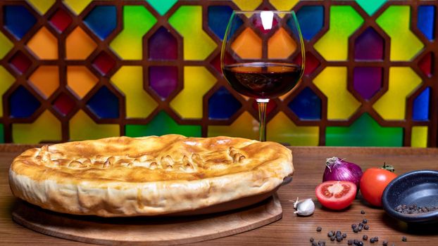 Tasty meat meal with bread, wine glass