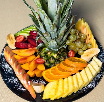 Fruit mix on the black plate