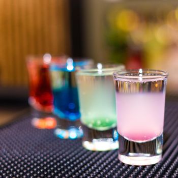 Colorful alcohol cocktails with blur background