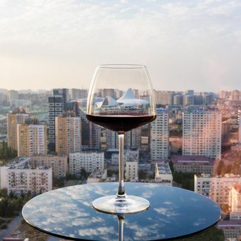 Red wine glass with city view, Heydar Aliyev Centre