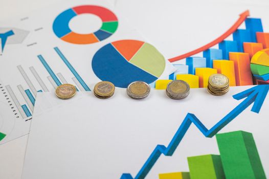 euro coins different denominations with statistics as colorful background