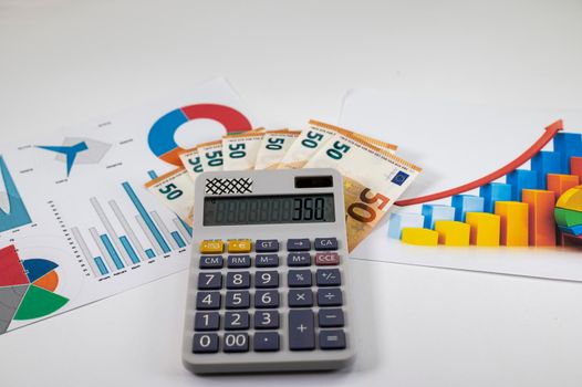 50 euro banknotes with statistics and calculator on white background