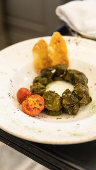 Dolma meat meal with tomato close up