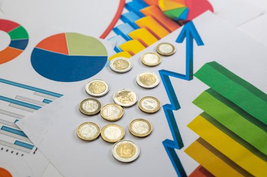 euro coins different denominations with statistics as colorful background