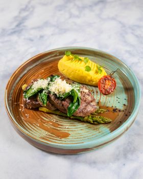 Tasty steak with potato, tomato