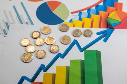 euro coins different denominations with statistics as colorful background