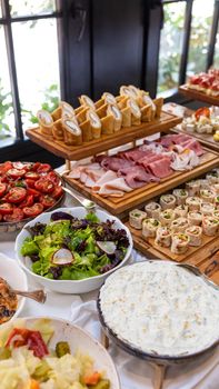 Tasty snack, garnish on the wooden plate