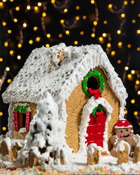 Christmas, new year house shape cake with bokeh, lights