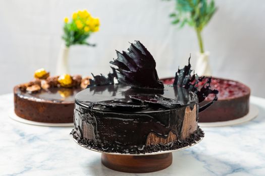 Different beautiful chocolate cakes on the white background