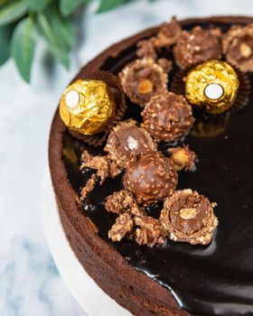 Beautiful chocolate cake on the white background, close up