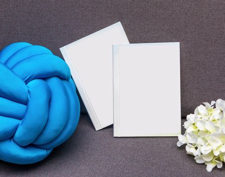 White postcard book with flower isolated