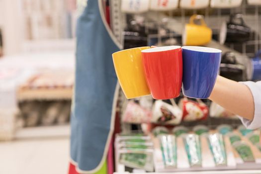 Woman holding a colorful drink cups at the store