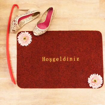 Red welcome doormat top view, welcome word in the Turkish