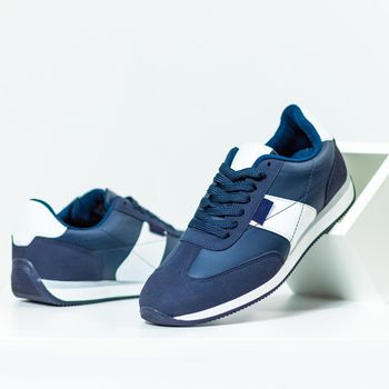 Blue male sneakers shoes isolated background