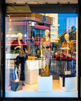 Fashion storefront mockup, female mannequins inside
