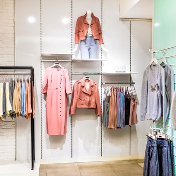 An empty woman fashion store with mannequin displaying the latest trend