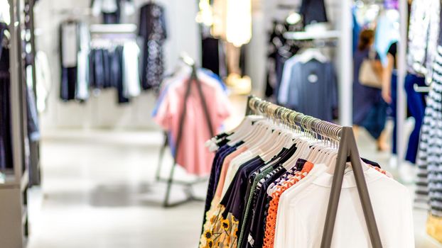 Woman clothing on hanger at the modern shop boutique