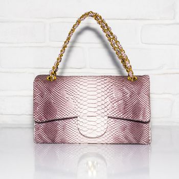 Patterned purple female bag on a white background isolated
