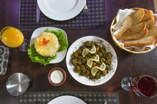 Tasty dolma, meat meal lemon on it, top view