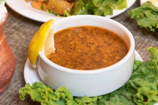 Lentil soup with lemon close up