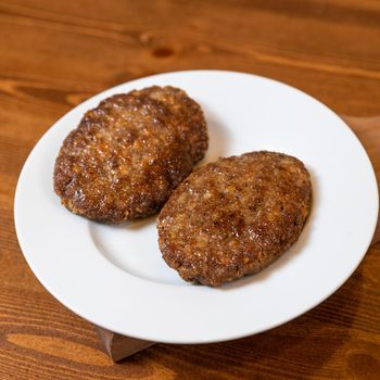 Beef cutlet on the plate close up