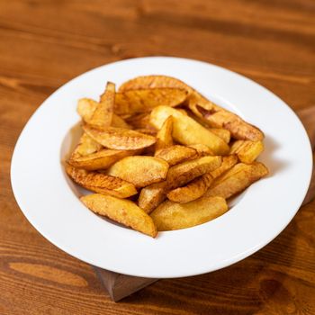 Fried tasty potato close up