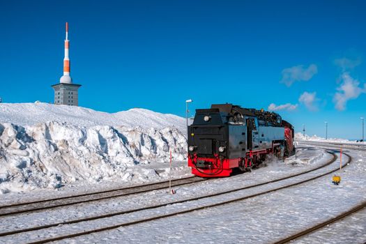 Harz national park Germany, Steam train on the way to Brocken through the winter landscape, Famous steam train through the winter mountain. Brocken, Harz National Park Mountains in Germany Europe