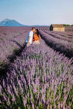 Provence, Lavender field France, Valensole Plateau, colorful field of Lavender Valensole Plateau, Provence, Southern France. Lavender field. Europe. Couple men and woman on vacation at the provence lavender fields,