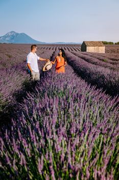 Provence, Lavender field France, Valensole Plateau, colorful field of Lavender Valensole Plateau, Provence, Southern France. Lavender field. Europe. Couple men and woman on vacation at the provence lavender fields,