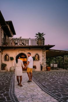 Luxury country house with swimming pool in Italy. Pool and old farm house during sunset central Italy. Couple on Vacation at luxury villa in Italy, men and woman watching sunset