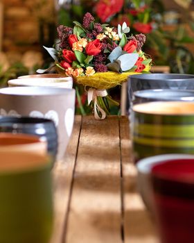 Beautiful flower bouquet with colorful pots