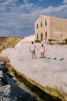 Punta Bianca, Agrigento in Sicily Italy White beach with old ruins of an abandoned stone house on white cliffs. Sicilia Italy, couple on vacation in Italy