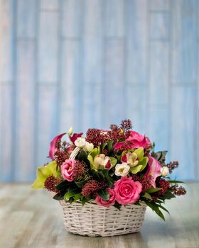 Colorful pink flower bouquet in the basket