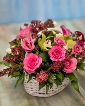 Colorful pink flower bouquet in the basket