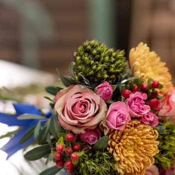 Beautiful flower bouquet in the table with bouquet florist equipments