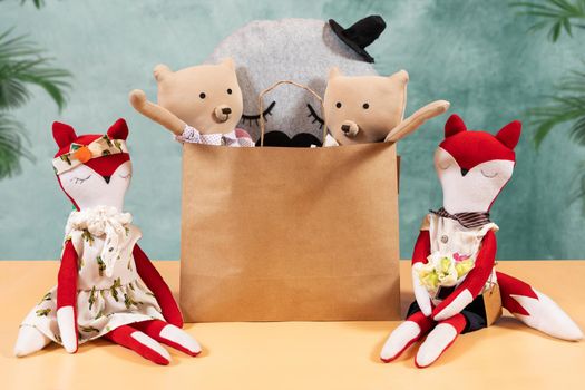 Different animal toys in the shopping bag, fox, bear and more