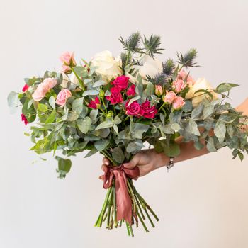 Woman holding beautiful flower bouquet