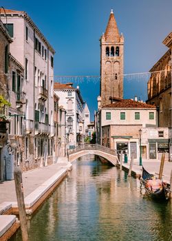 Beautiful venetian street in summer day, Italy. Venice Europe