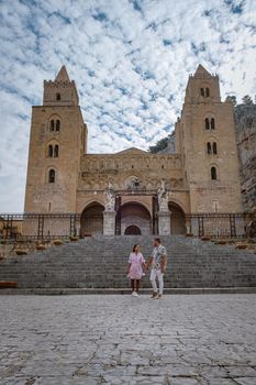 Cefalu, the medieval village of Sicily island, Province of Palermo, Italy. Europe, a couple on vacation at the Italian Island Sicilia