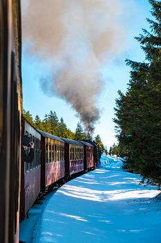 Harz national park Germany, Steam train on the way to Brocken through the winter landscape, Famous steam train through the winter mountain. Brocken, Harz National Park Mountains in Germany Europe