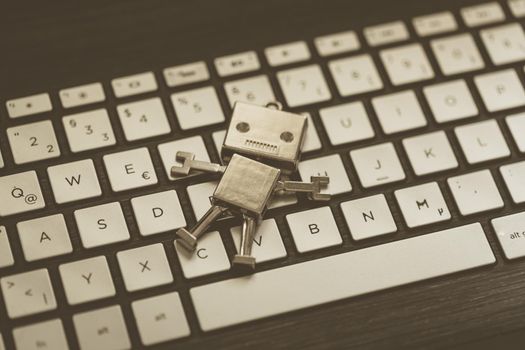 Symbol for a chatbot or social bot and algorithms, program code in the background