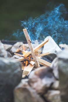 Making fire in the wood, camping outdoors