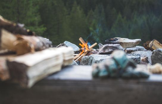 Making fire in the wood, camping outdoors