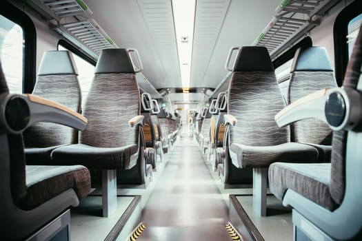Interior of a public transport train, blurry background