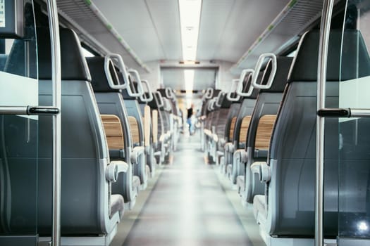 Interior of a public transport train, blurry background